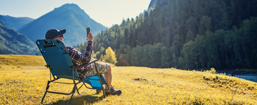 Traveller logging onto app to contact 24/7 emergency assistance team while on holidays