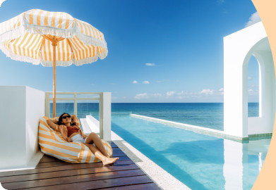 Woman relaxing next to a pool on holidays