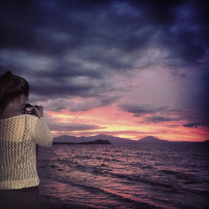 Cover-More New Zealand Facebook photo competition winner: Girl watching sunset on Lake Taupo, New Zealand