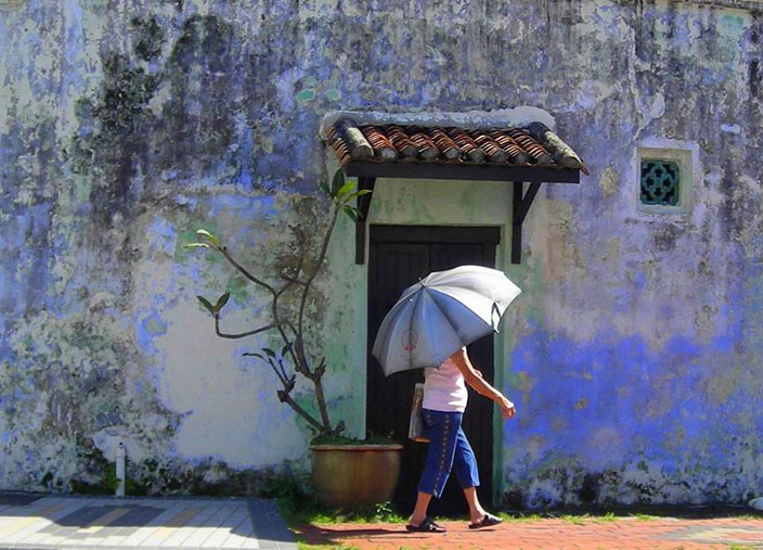 Cover-More New Zealand Facebook photo competition winner: Woman walking down a little street in Georgetown, Penang