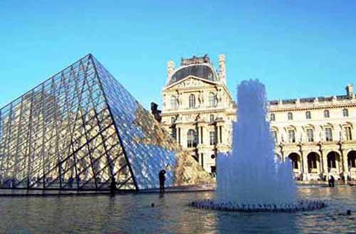 The Louvre’s distinctive glass pyramid marks the entrance to one of the world’s largest museums, located in Paris.