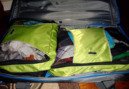 Packing cubes are a great way to match outfits and keep rolled items in the same shape and place in your luggage.