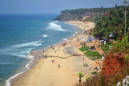 The colourful buildings and winding coastline are just a few draws of Papnasam Beach in Kerala, India.