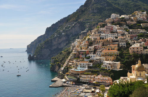 A view of Positano, a stunningly beautiful Italian city that’s carved into the hills of the Amalfi Coast. Positano falls alone one of the routes of the best road trips in the world.