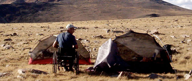 A man camps in wheelchair at Mt. White in California, USA.