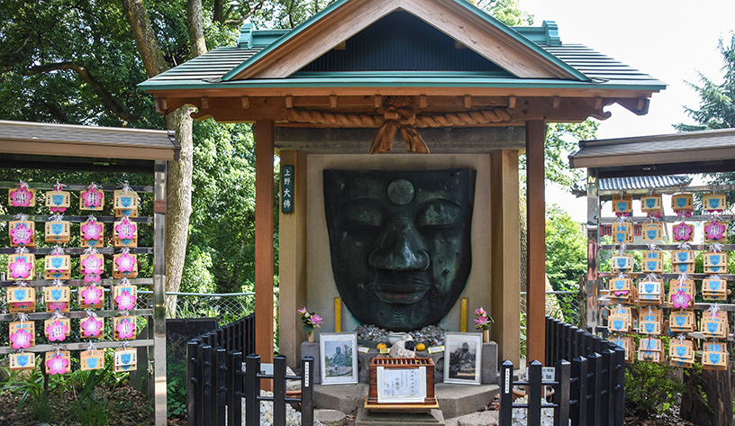 face statue at temple in japan