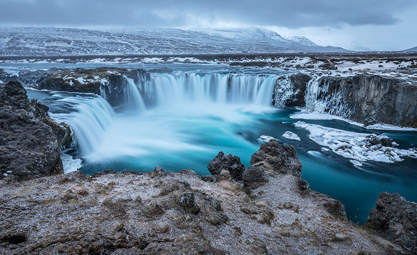 frozen waterfall in iceland during winter