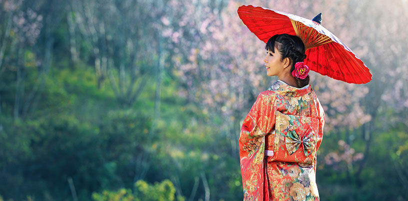 Japanese woman in kimono with paper umbrella  