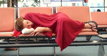 Woman asleep in airport