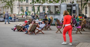 People on deckchairs outside